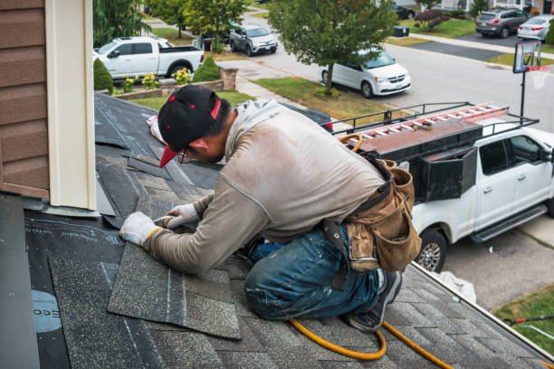 Professional Storm Damage Roof Repair technician working in Boxborough, MA